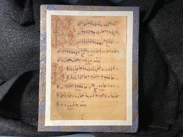 Photo showing a sheet of music from the box museum